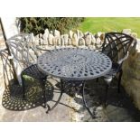 A 'Lazy Susan' aluminium dining table & two chairs
