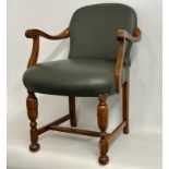 Tremaine Manor: An oak framed leather upholstered desk chair, 35in high to back