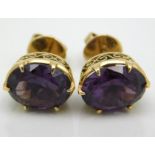 A pair of yellow metal amethyst earrings, electron