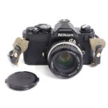 A Nikon FM - 3115998 35mm film camera with lens ho