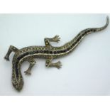 A .925 marked silver lizard brooch set with marcas