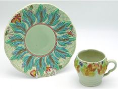 A Clarice Cliff turquoise ground plate with relief