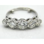An antique five stone platinum ring set with appro