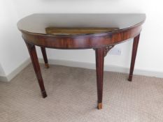 Tremaine Manor House: A mahogany 'D' shaped table,
