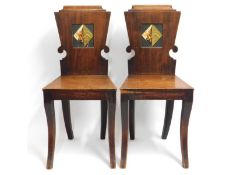 A pair of 19thC. mahogany hall chairs with hand pa
