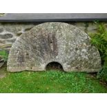 Miller's Cottage: Half of a granite millstone, 50i