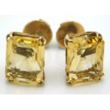A pair of 14ct gold earrings set with yellow topaz