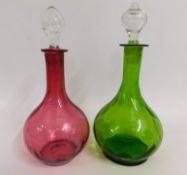 Two Victorian coloured glass decanters including c