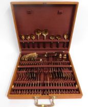 A bronze & teak retro canteen of cutlery for eight