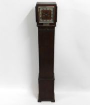 A 1930's art deco period grand daughter clock pres