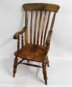 A 19thC. elm Windsor style armchair, both arms a/f
