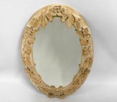 A decorative mirror with carved relief decor, 35in