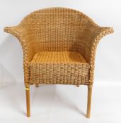 A cane & wicker armchair, 33in high to back