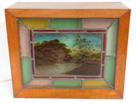 A cased stained glass with central painted panel l