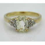 A 9ct gold ring set with diamond & possibly, a pal