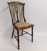 A decorative, stained bedroom chair, 36.25in high to back