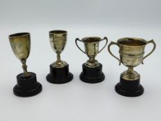 Four small Birmingham silver sporting trophies awa