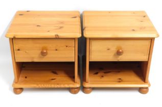 A pair of pine bedside tables with drawer & shelf