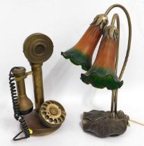 A brass mounted art nouveau styled lamp with glass