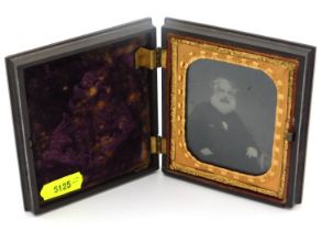 A mounted daguerreotype in decorative case, one hi