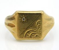 A 9ct gold diamond set signet ring with chased dec