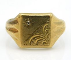 A 9ct gold diamond set signet ring with chased dec