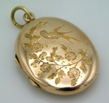 A 9ct gold locket with chased floral & bird decor,