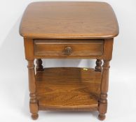 An Ercol 'Golden Dawn' elm lamp table with drawer