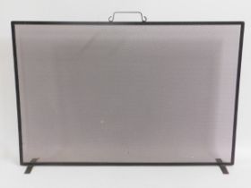 A metal firescreen, 36in wide x 23.5in high