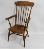 A 19thC. elm Windsor armchair, later added steel r