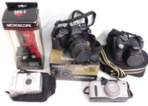 A Finepix 2800D bridge camera, two other point & s