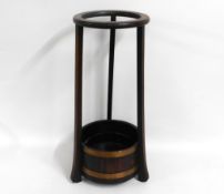 An antique oak stick stand with coopered base & in