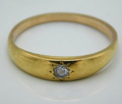 A yellow metal ring set with 0.1ct of diamond, tes