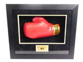 A cased boxing glove hand signed by former world h