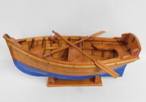 A substantial, hand made mounted wooden rowing boa