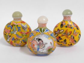 Three yellow ground Chinese glass snuff bottles