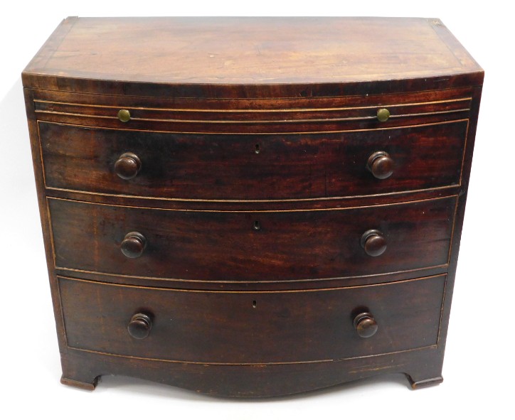 A compact 19thC. Regency style bow fronted chest 3