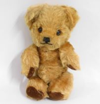 A mid 20thC. teddy bear, 9in tall