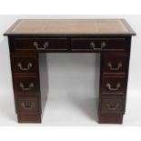 A small mahogany knee hole desk, 35.5in wide x 29.