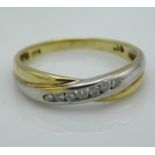 A two colour, 9ct gold interlocking ring set with