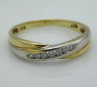 A two colour, 9ct gold interlocking ring set with