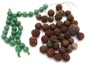 A quantity of 19thC. Chinese jade beads twinned wi