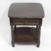 An Ercol elm lamp table with drawer & shelf under,