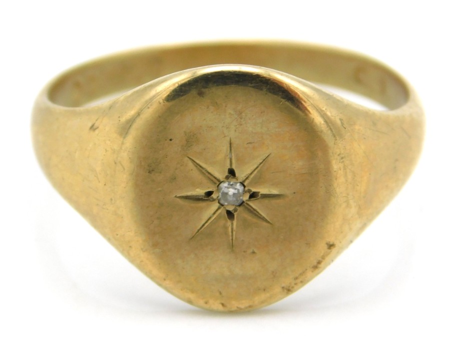 A 9ct gold signet ring set with diamond, 4.3g, siz