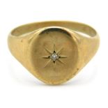 A 9ct gold signet ring set with diamond, 4.3g, siz