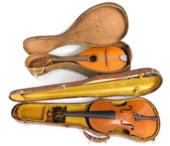 A cased mandolin twinned with a violin