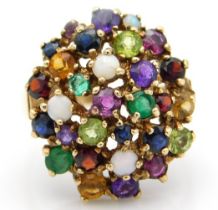 A 9ct gold cluster ring set with opal, emerald, am