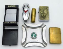 A Rizla+ Zippo lights, cased, twinned with a brass