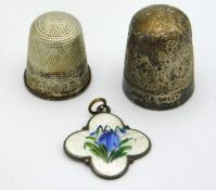 A white metal thimble, maker H.C & S, twinned with