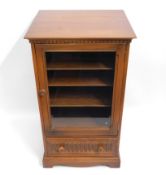 An Ercol 'Golden Dawn' elm hifi separates cabinet with adjustable shelves & drawer, 38in high x 21.8